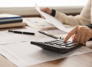 bookkeeper inspector calculated and checking balance account. accounting and auditing concept.